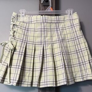 Pastel yellow pleated mini skirt. Forever 21. Barely worn if at all.